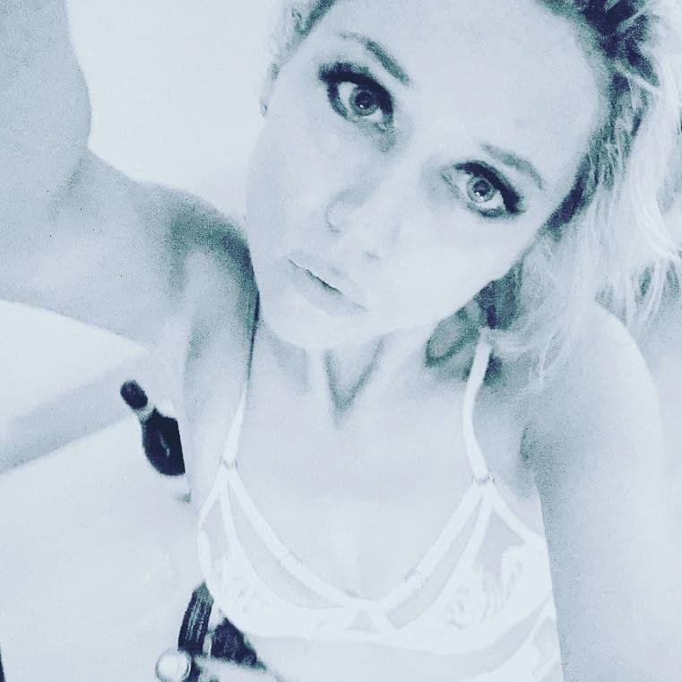 Petite blonde exhibitionist babe ready to party